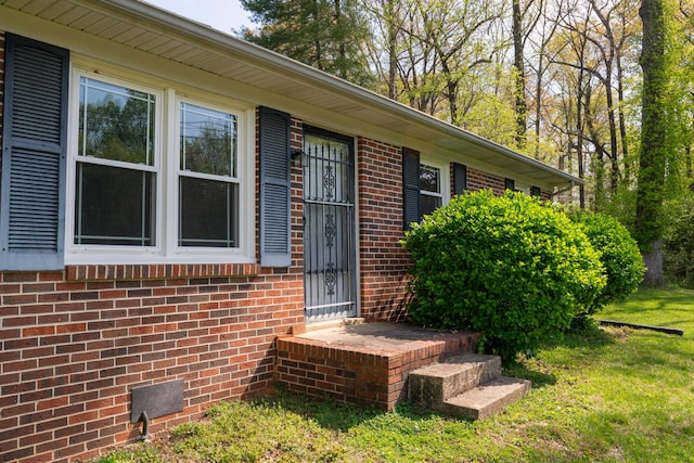 1203 W White Oak Dr, Cookeville, TN 38501 - doorway to property featuring a yard and brick siding