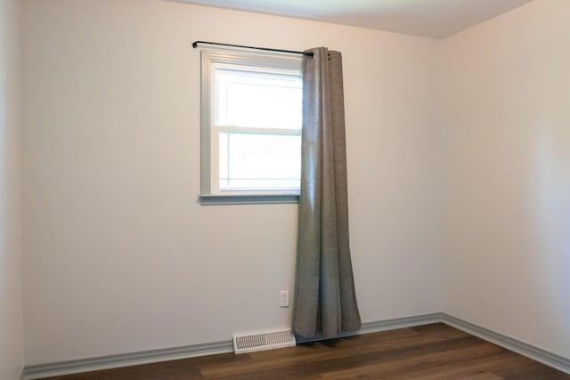 1203 W White Oak Dr, Cookeville, TN 38501 - spare room featuring visible vents, baseboards, and dark wood finished floors