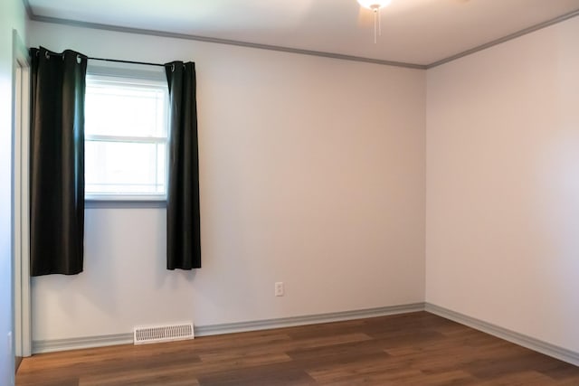 1203 W White Oak Dr, Cookeville, TN 38501 - empty room with visible vents, baseboards, ornamental molding, and wood finished floors