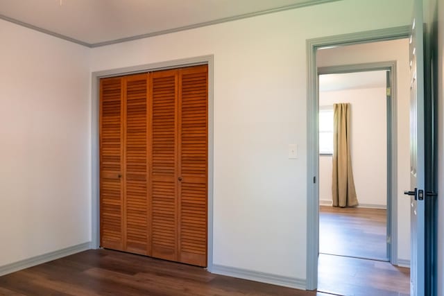 1203 W White Oak Dr, Cookeville, TN 38501 - unfurnished bedroom with baseboards, a closet, ornamental molding, and wood finished floors