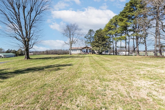 view of yard with a rural view