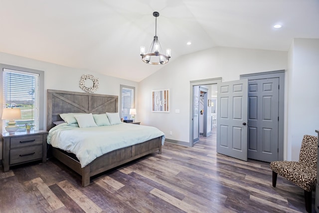 bedroom with an inviting chandelier, recessed lighting, lofted ceiling, and dark wood-style flooring
