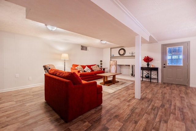living room featuring wood finished floors and baseboards