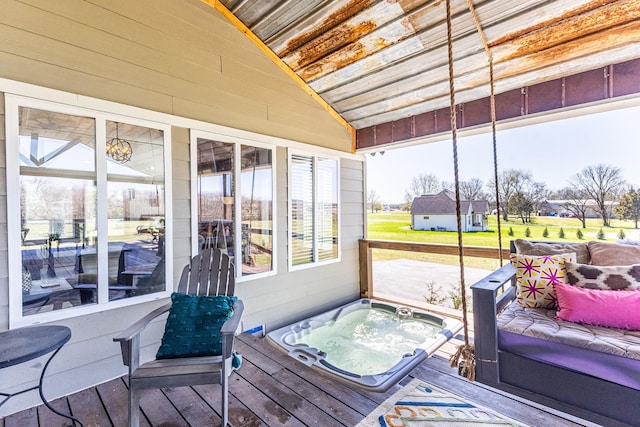 sunroom / solarium featuring a hot tub