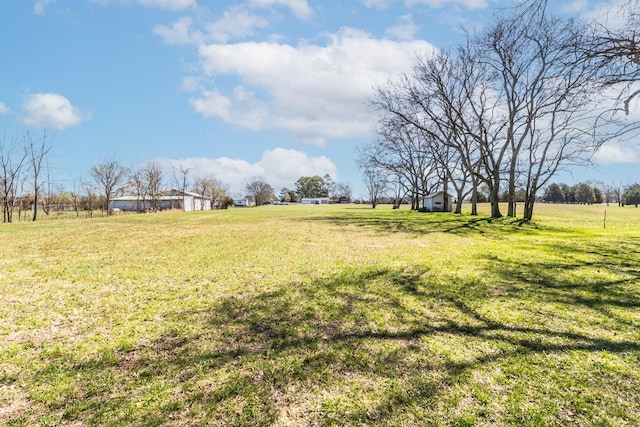 view of yard with a rural view