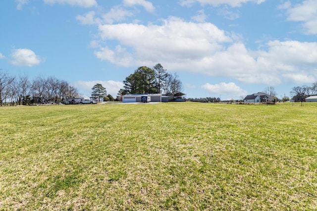 view of yard with a rural view
