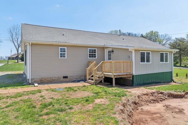 rear view of house featuring crawl space, roof with shingles, and a wooden deck