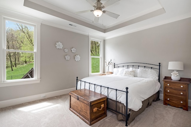 700 Pendragon Ct, Franklin, TN 37067 - bedroom featuring visible vents, baseboards, a tray ceiling, and light colored carpet