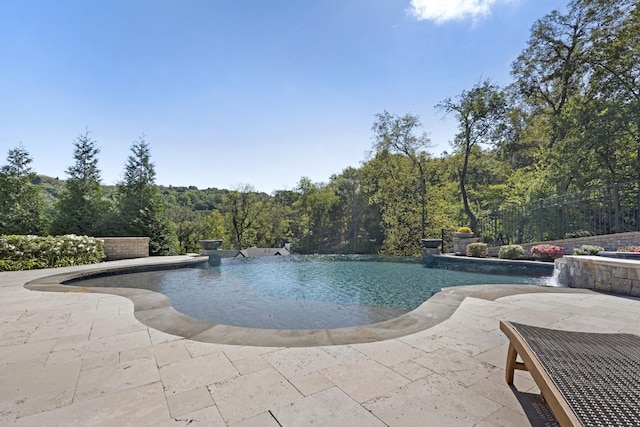 700 Pendragon Ct, Franklin, TN 37067 - outdoor pool with a patio area and a wooded view