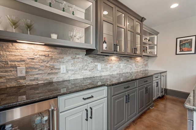 700 Pendragon Ct, Franklin, TN 37067 - bar with a bar, decorative backsplash, concrete flooring, and wine cooler