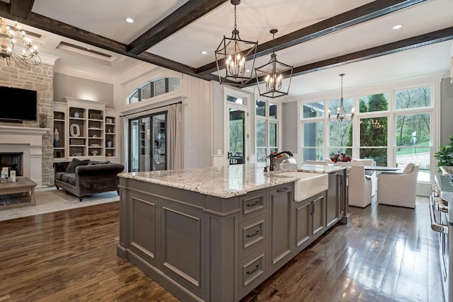700 Pendragon Ct, Franklin, TN 37067 - kitchen featuring an inviting chandelier, dark wood finished floors, a sink, open floor plan, and gray cabinetry
