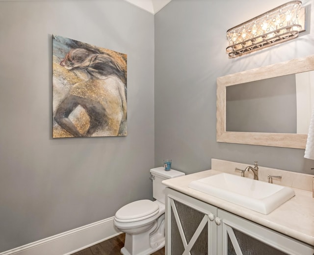 700 Pendragon Ct, Franklin, TN 37067 - bathroom with vanity, baseboards, toilet, and wood finished floors