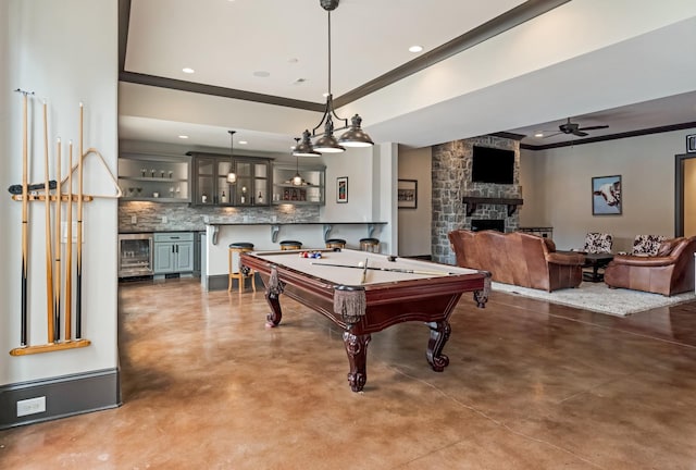 700 Pendragon Ct, Franklin, TN 37067 - playroom with a stone fireplace, a ceiling fan, billiards, finished concrete flooring, and beverage cooler