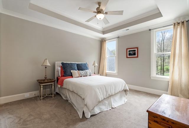 700 Pendragon Ct, Franklin, TN 37067 - carpeted bedroom with visible vents, a tray ceiling, baseboards, and a ceiling fan