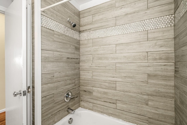 bathroom with bathing tub / shower combination