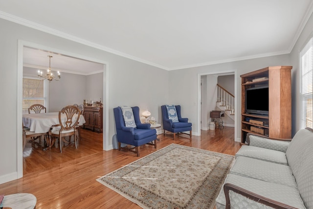 125 Sunnyside Ln, Columbia, TN 38401 - living area featuring crown molding, stairs, a chandelier, light wood finished floors, and baseboards
