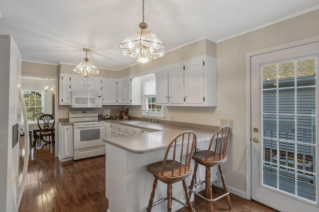 125 Sunnyside Ln, Columbia, TN 38401 - kitchen featuring an inviting chandelier, a sink, white appliances, a peninsula, and dark wood-style flooring