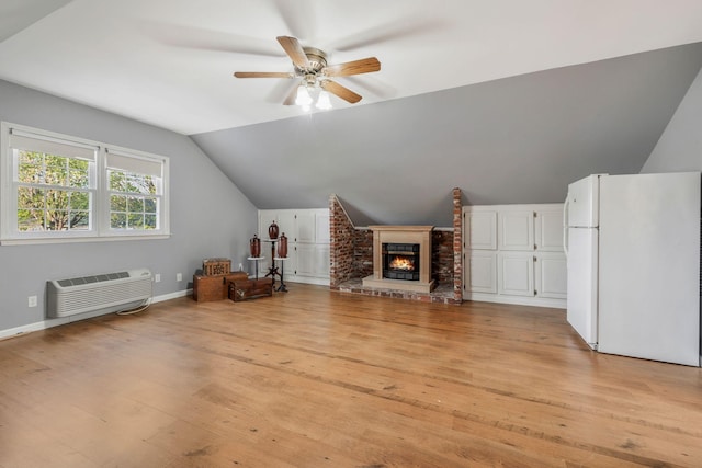 125 Sunnyside Ln, Columbia, TN 38401 - additional living space with vaulted ceiling, an AC wall unit, light wood-type flooring, baseboards, and ceiling fan