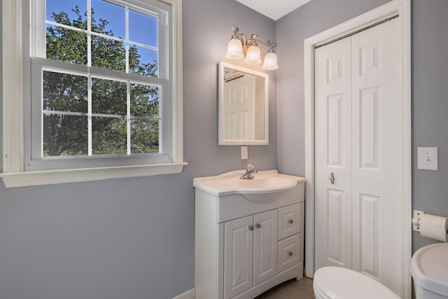 125 Sunnyside Ln, Columbia, TN 38401 - bathroom with tile patterned flooring, an inviting chandelier, toilet, vanity, and a closet