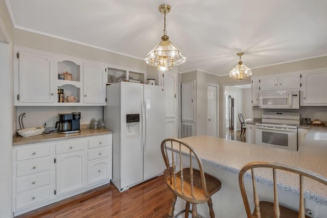 125 Sunnyside Ln, Columbia, TN 38401 - kitchen with open shelves, a chandelier, white appliances, white cabinets, and a peninsula
