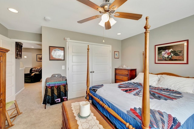 bedroom featuring a closet, recessed lighting, light colored carpet, and ceiling fan