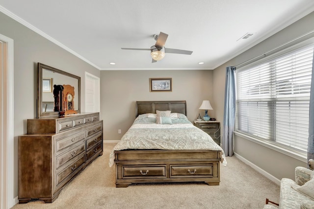 bedroom featuring crown molding, visible vents, baseboards, and light colored carpet