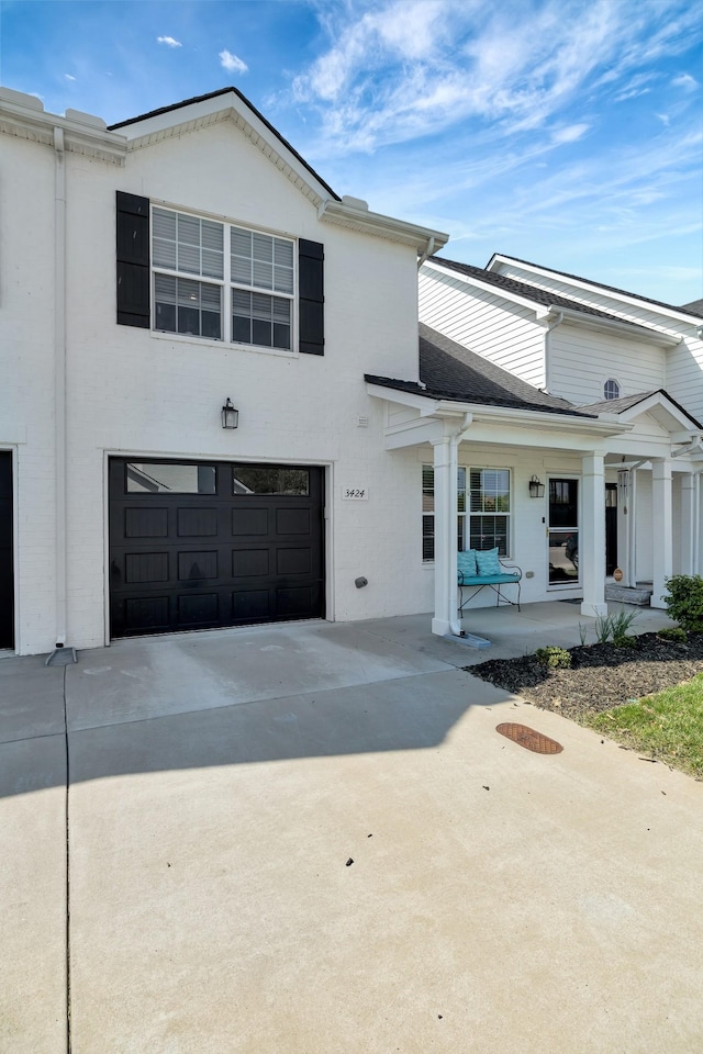 view of front of property featuring a garage and driveway