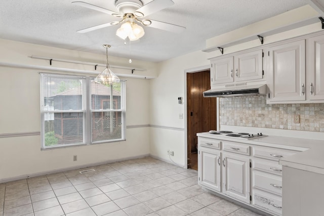 3720 Priest Lake Dr, Nashville, TN 37217 - kitchen with white electric stovetop, decorative backsplash, under cabinet range hood, light countertops, and ceiling fan