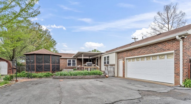 3720 Priest Lake Dr, Nashville, TN 37217 - ranch-style home with an attached garage, aphalt driveway, and brick siding