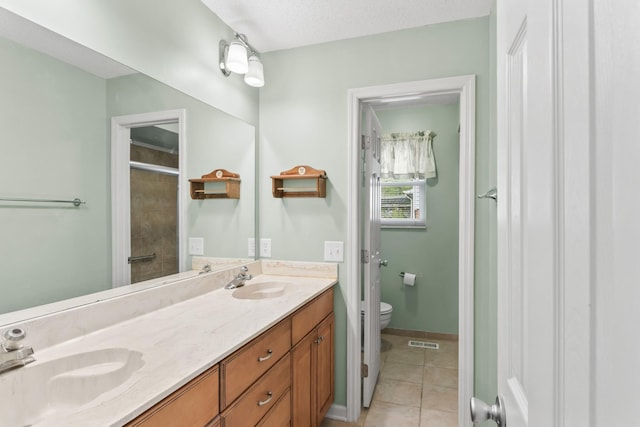 3720 Priest Lake Dr, Nashville, TN 37217 - full bath featuring visible vents, toilet, tile patterned flooring, and a sink