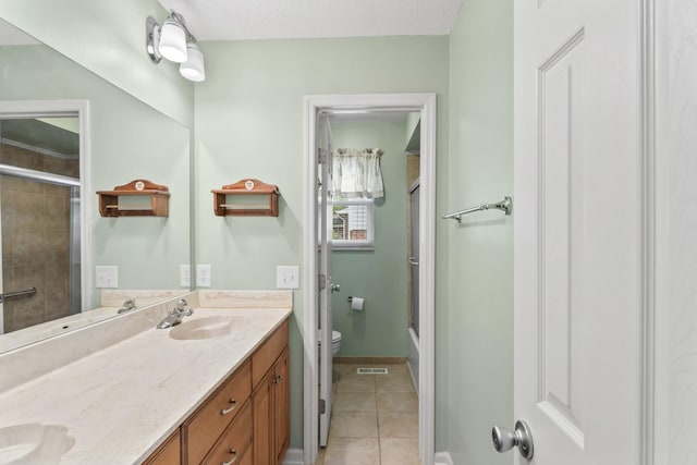 3720 Priest Lake Dr, Nashville, TN 37217 - full bathroom featuring a sink, toilet, visible vents, tile patterned flooring, and a shower with door