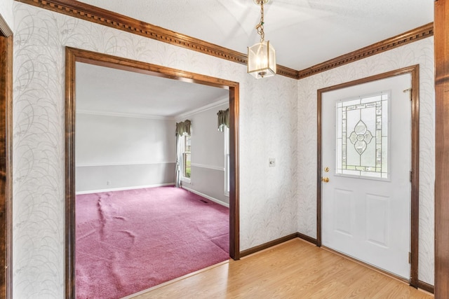 3720 Priest Lake Dr, Nashville, TN 37217 - foyer entrance featuring light wood finished floors, ornamental molding, wallpapered walls, and baseboards