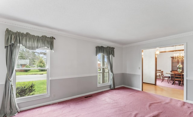 3720 Priest Lake Dr, Nashville, TN 37217 - carpeted spare room with crown molding, a notable chandelier, baseboards, and visible vents