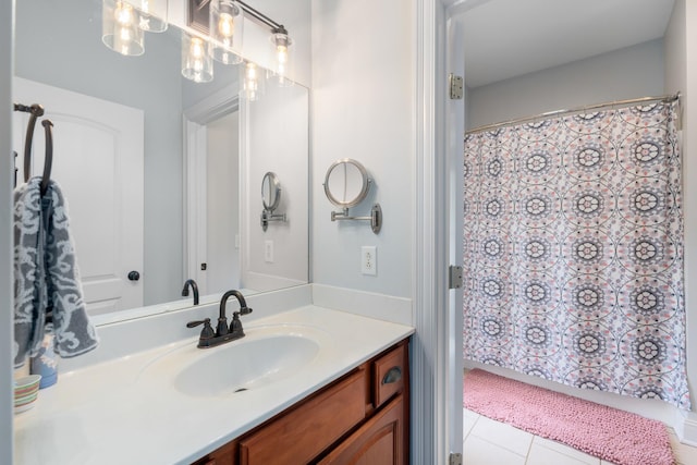 full bath with tile patterned floors, vanity, and curtained shower