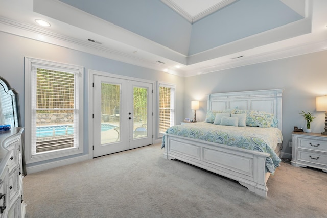 bedroom with french doors, access to exterior, multiple windows, and light colored carpet