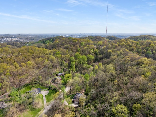 aerial view featuring a wooded view
