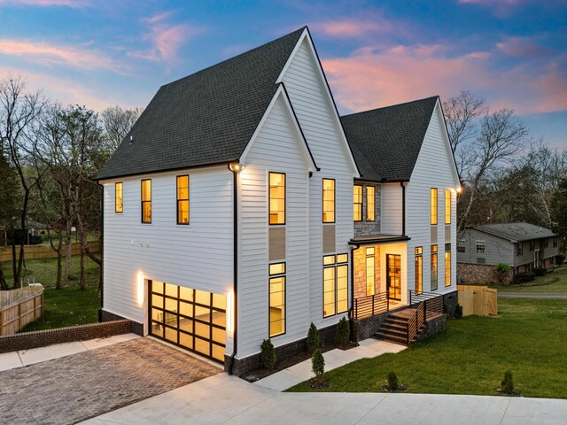 819 Davidson Dr, Nashville, TN 37205 - view of front of property with a garage, a yard, driveway, and a shingled roof