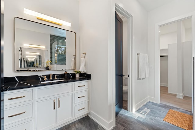819 Davidson Dr, Nashville, TN 37205 - bathroom with vanity, baseboards, visible vents, and toilet