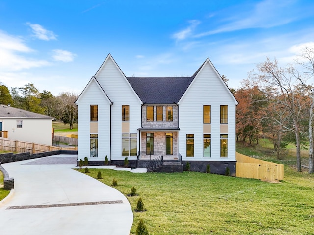 819 Davidson Dr, Nashville, TN 37205 - modern farmhouse style home featuring concrete driveway, roof with shingles, fence, and a front lawn