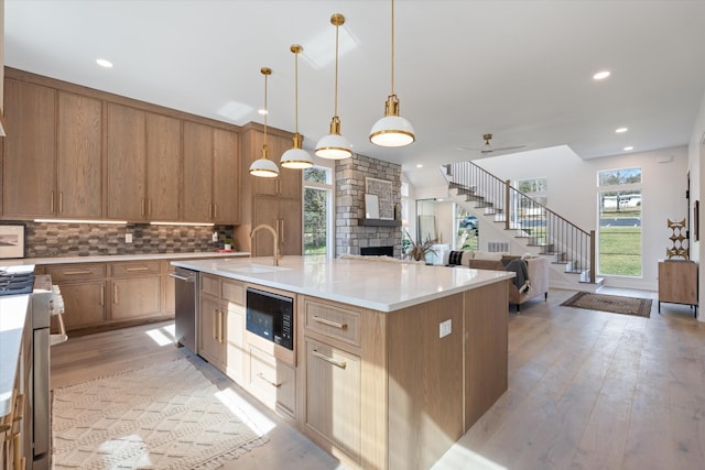 819 Davidson Dr, Nashville, TN 37205 - kitchen with a sink, a healthy amount of sunlight, light wood finished floors, and stainless steel appliances