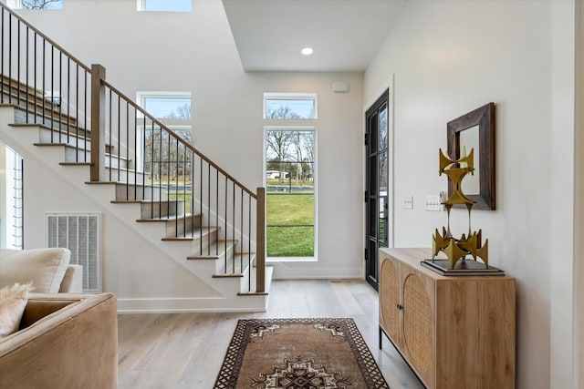 819 Davidson Dr, Nashville, TN 37205 - entryway featuring visible vents, light wood-style flooring, stairway, and baseboards
