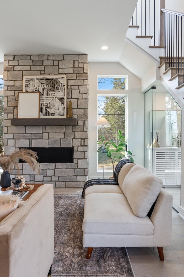 819 Davidson Dr, Nashville, TN 37205 - living room with stairs, lofted ceiling, a stone fireplace, and wood finished floors