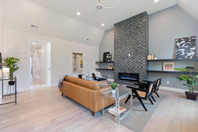 819 Davidson Dr, Nashville, TN 37205 - living room with visible vents, baseboards, wood finished floors, high vaulted ceiling, and a tile fireplace