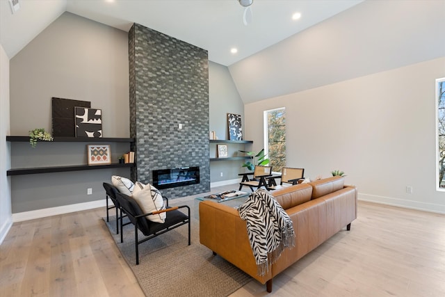 819 Davidson Dr, Nashville, TN 37205 - living room with baseboards, recessed lighting, a tiled fireplace, high vaulted ceiling, and wood finished floors