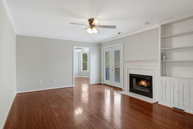 1719 Wynnewood Dr, Chapmansboro, TN 37035 - unfurnished living room featuring a ceiling fan, baseboards, ornamental molding, and wood finished floors