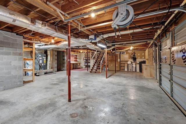 1719 Wynnewood Dr, Chapmansboro, TN 37035 - unfinished basement featuring heating unit and stairway