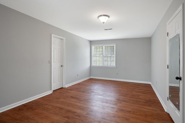 1719 Wynnewood Dr, Chapmansboro, TN 37035 - empty room featuring baseboards, wood finished floors, and visible vents