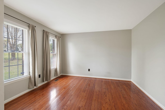 1719 Wynnewood Dr, Chapmansboro, TN 37035 - unfurnished room featuring visible vents, baseboards, and wood finished floors