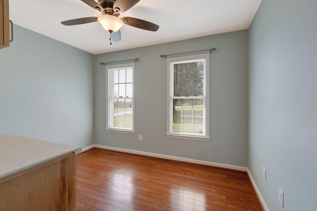 1719 Wynnewood Dr, Chapmansboro, TN 37035 - spare room with light wood-type flooring, baseboards, and ceiling fan