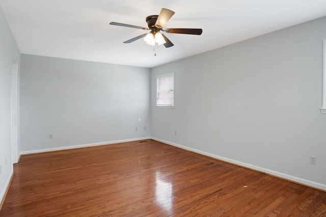 1719 Wynnewood Dr, Chapmansboro, TN 37035 - unfurnished room with wood finished floors, a ceiling fan, and baseboards